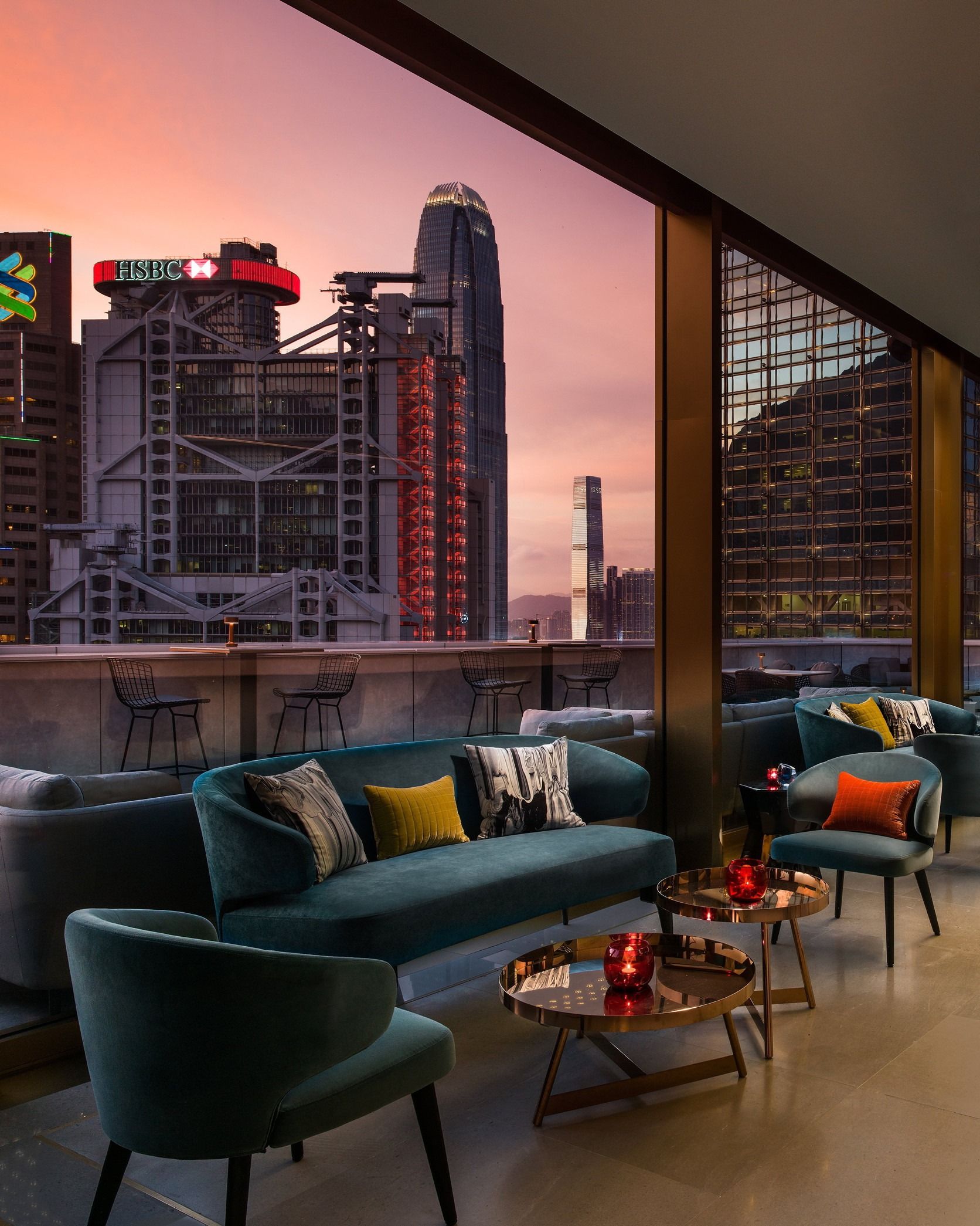 Popinjays’ terrace, with turquoise-velvet sofas and chairs, looking out towards the HSBC building